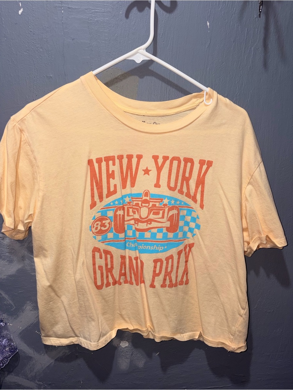 Rebellious One Peach Short Sleeve Tee with Orange and Blue Racing Graphic